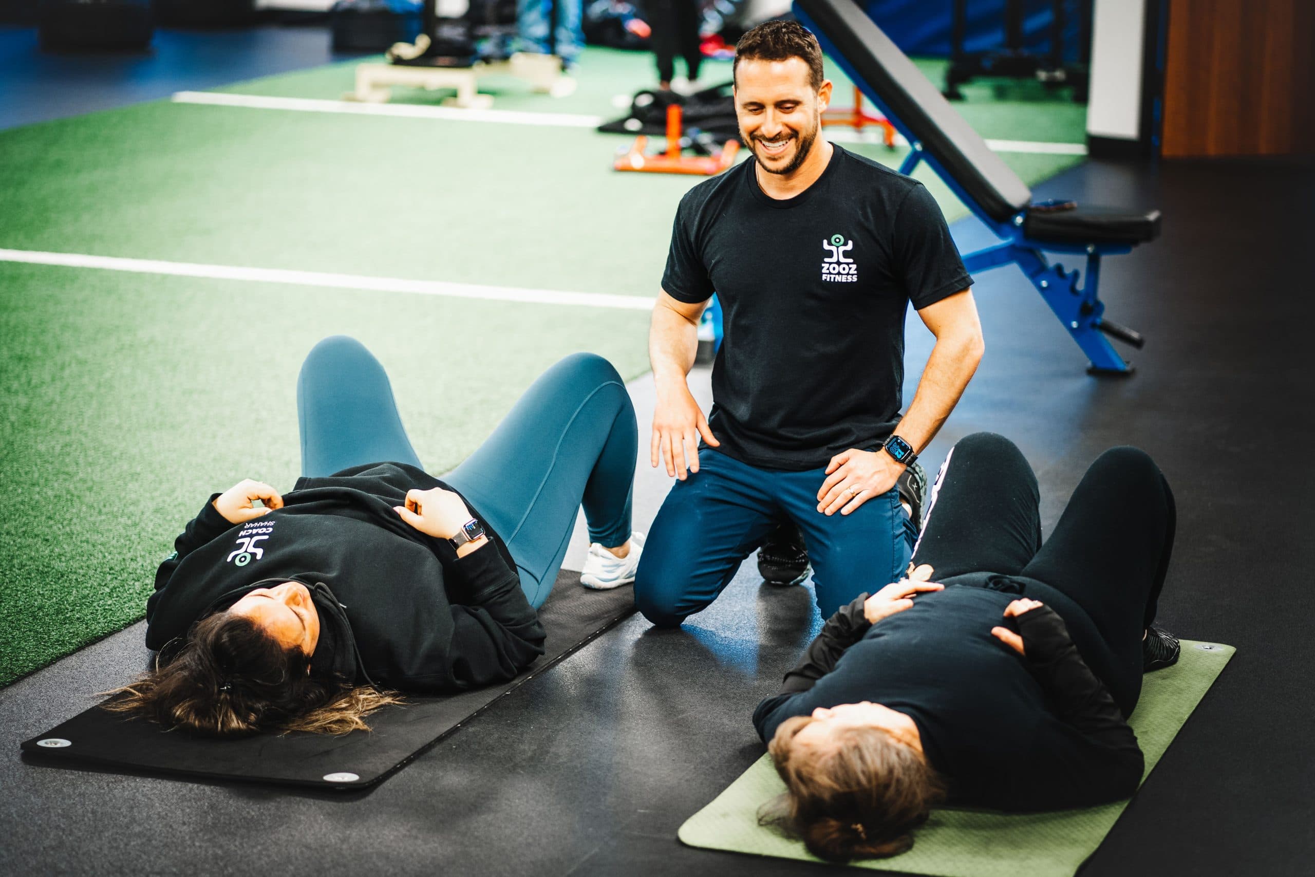 A coach working one-on-one with an athlete